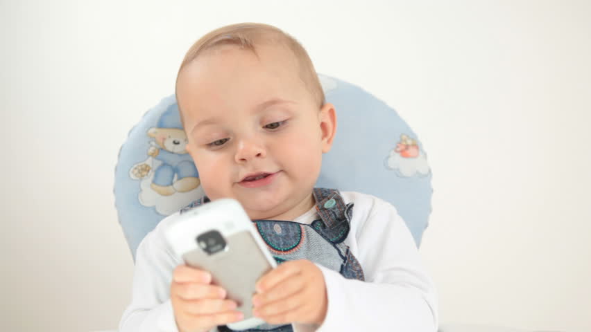 Baby plays with cellphone