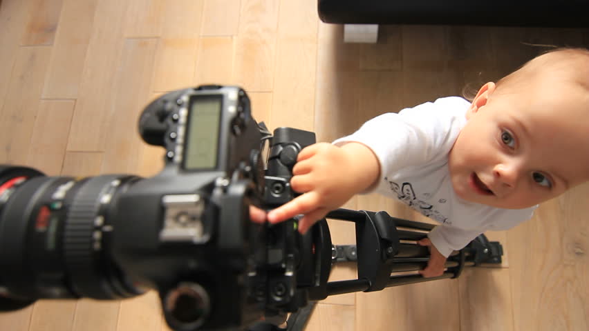 Baby plays with camera