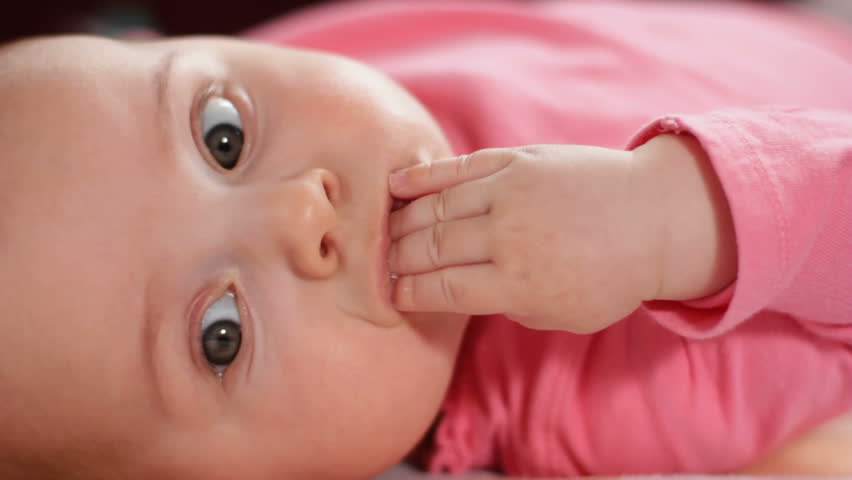 Infant bites hand