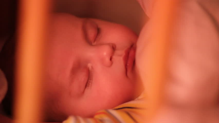 Infant asleep in crib