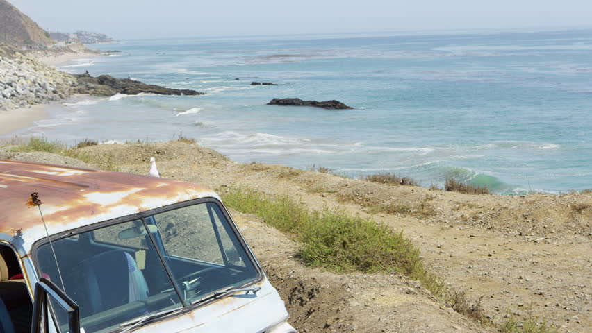 Friends hanging out by van