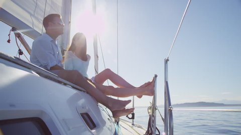 Couple relaxing together on Sail Boat, Seattle, WA