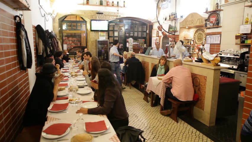 Paris, France - May 6th, 2012: People eat dinner at restaurant