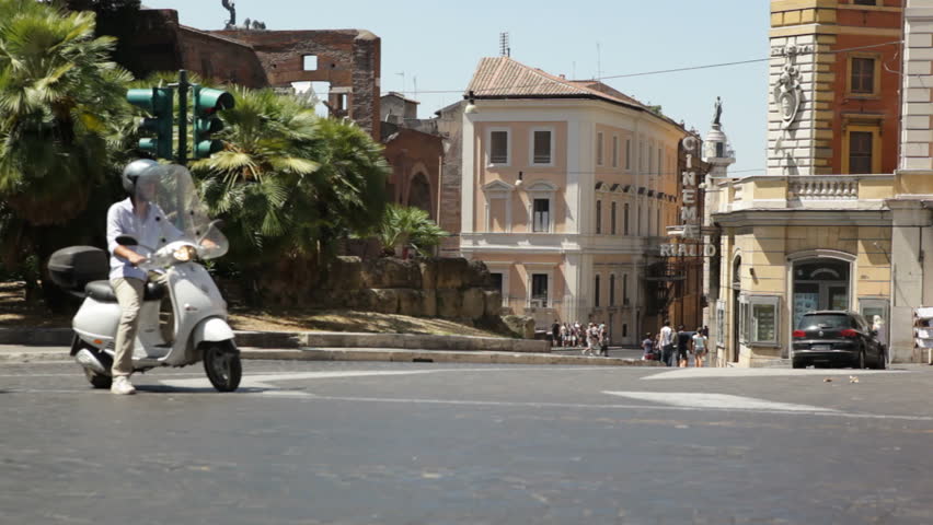 Rome, Italy - February 15th, 2012 - Man on scooter in Rome