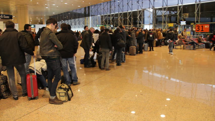 Barcelona, Spain - January 15th, 2013: Passengers wait in line at airport