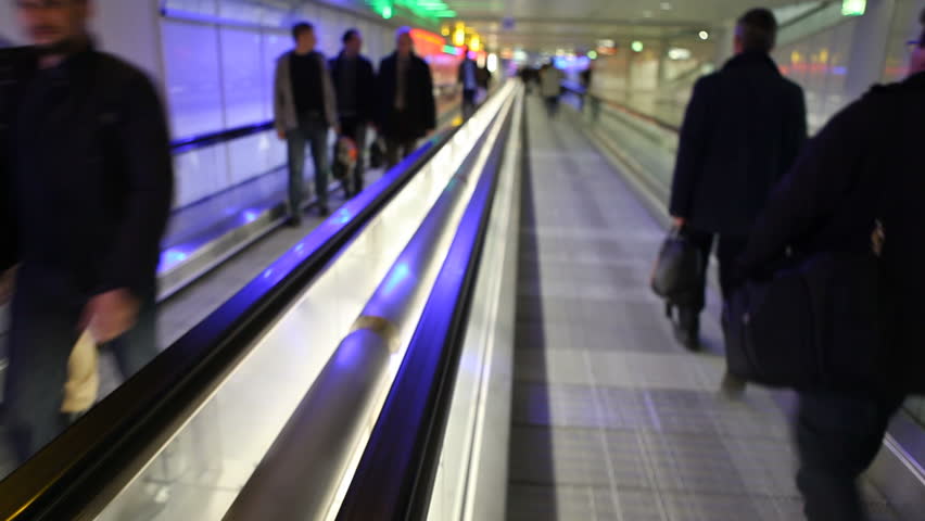 Munich, Germany - April 25th 2013: Airport walkway with passengers