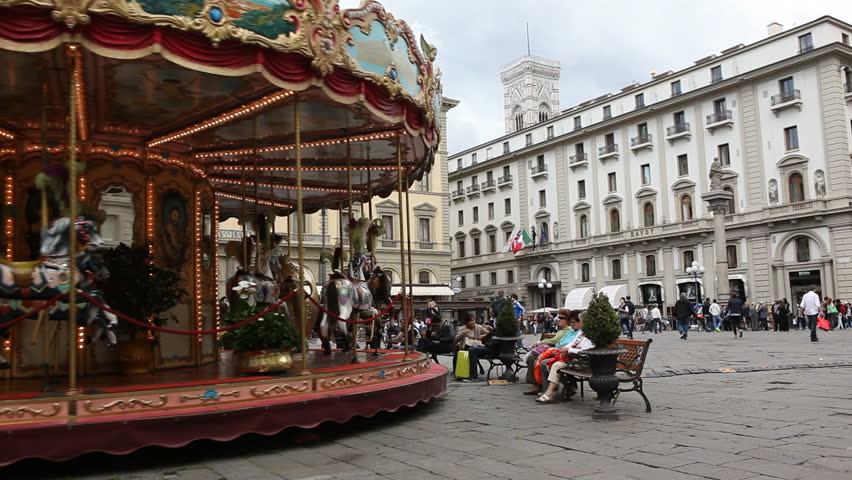 Florence, Italy - April 18th, 2013: Merry-go-round in town square
