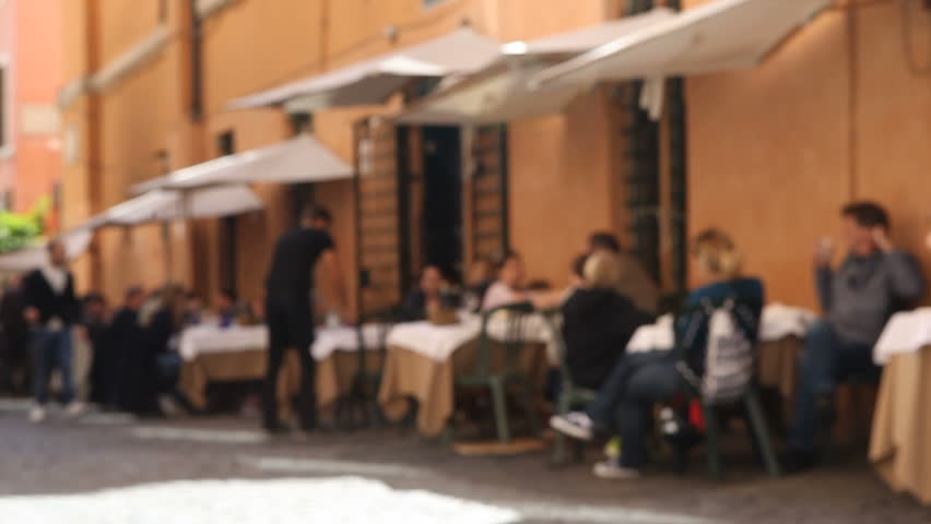 Rome, Italy - April 10th, 2013: People at outdoor restaurant