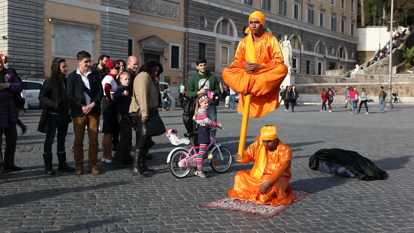 Rome, Italy - April 10th, 2013: Street artists do tricks