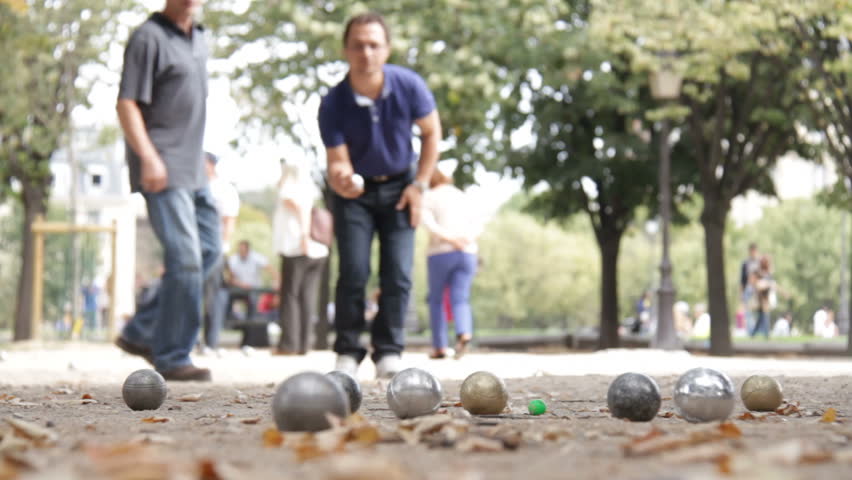 Paris, France - May 6th, 2012: Man play petangue boules in Paris