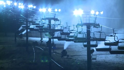 EARLY MORNING SNOW MAKING IN MOUNTAINS WITH SNOWMAKING EQUIPMENT HD HIGH DEFINITION 1080