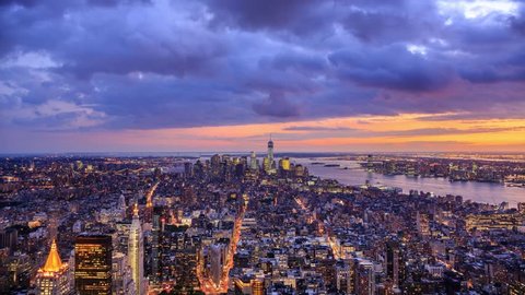 New York City Manhattan aerial panorama cityscape skyline. Transition from sunset to night. Timelapse.