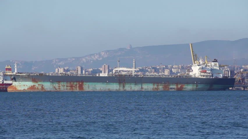 Seaside industry in Trieste, Italy. Shot of big cargo ships. High definition video.