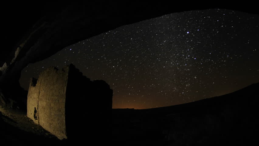 Time lapse star trail streaks over a Chacoan rock house in Gallo Wash in Chaco Culture National Historical Park, New Mexico.
