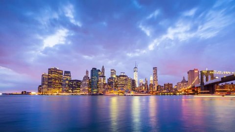 New York City night skyline reflected in water. Timelapse.