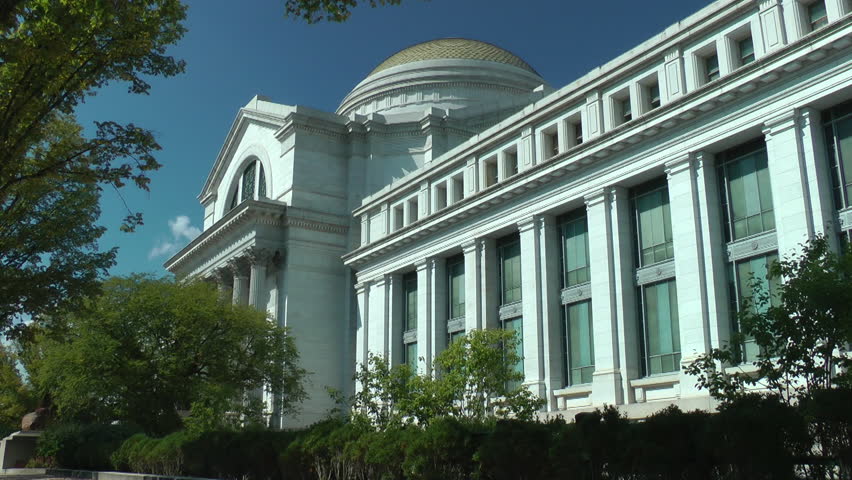 WASHINGTON, DC - OCT. 1 - 2013: Man passes Natural History Museum on National Mall. (Model release) Tourist? Fired worker?  Art thief?