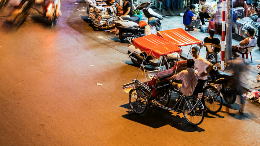 HANOI - SEPTEMBER 17: Timelapse view of cyclo taxi in Hanoi Hoan Kiem district