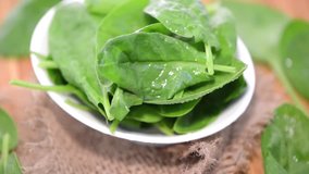 Portion of rotating raw Spinach (background video)