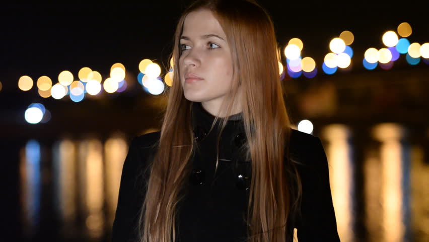 The young girl on a night promenade. The meeting , anticipation, love, dating  