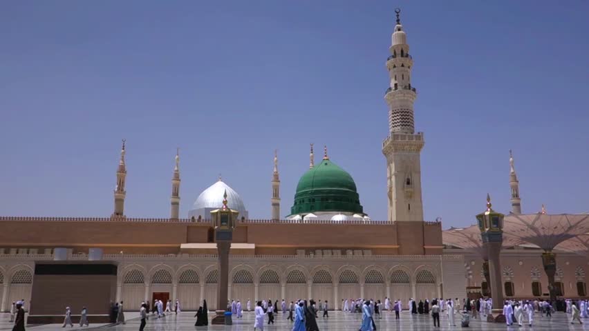 Moslems walk at Masjid Al Nabawi or Nabawi Mosque (Mosque of the Prophet) in Medina, Saudi Arabia.Nabawi mosque is Islam's second holiest mosque after Haram Mosque (in Mecca, Saudi Arabia)  Royalty-Free Stock Footage #4819001