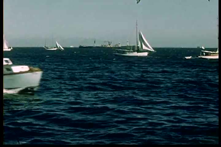 1950s - Two boys explore a harbor in the 1950s.