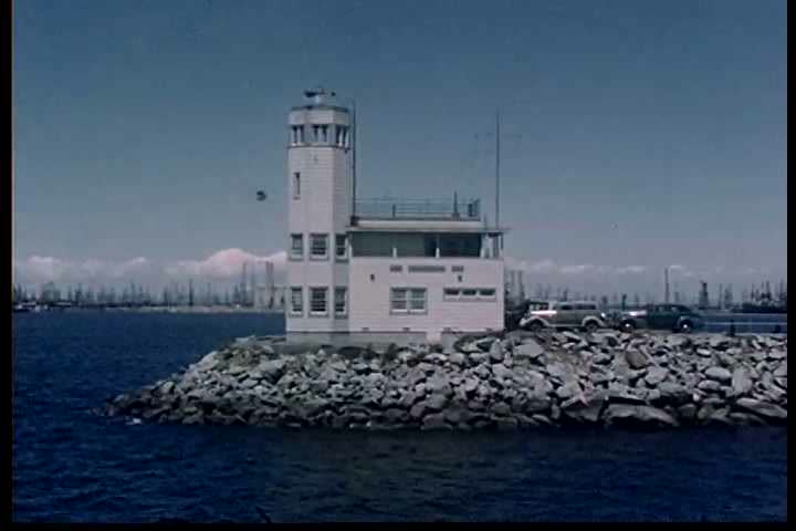 1950s - Two boys explore a harbor in the 1950s.