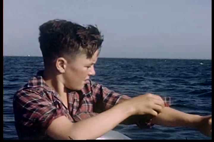 1950s - Two boys explore a harbor in the 1950s.
