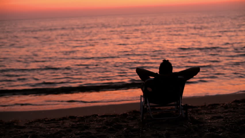 A Man Sits In Beach Stock Footage Video 100 Royalty Free 4821326 Shutterstock