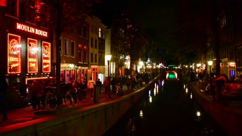 AMSTERDAM - SEP 11: Red Light District on September 11, 2013 in Amsterdam, Netherlands. There are near 500 red windows in the city rented by prostitutes and about 1000 working girls.