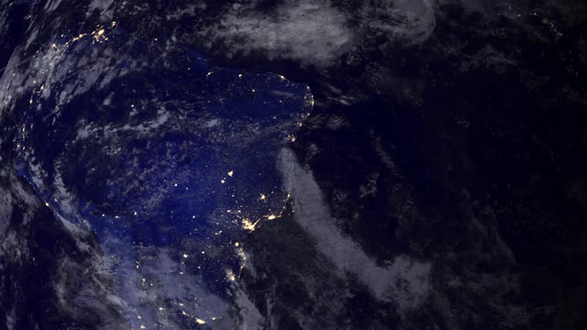 Telecommunication satellite over South America, night view from space.. Cinema