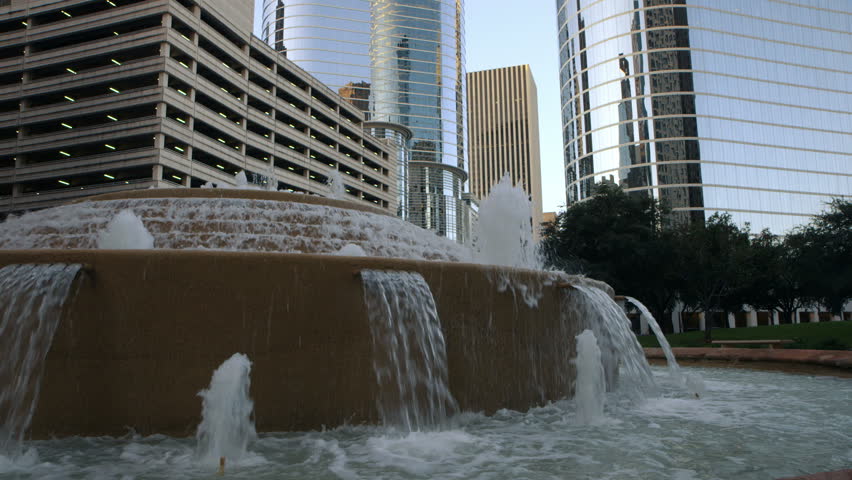 A fountain creates a lovely water feature in the midst of skyscrapers in downtown Houston TX.