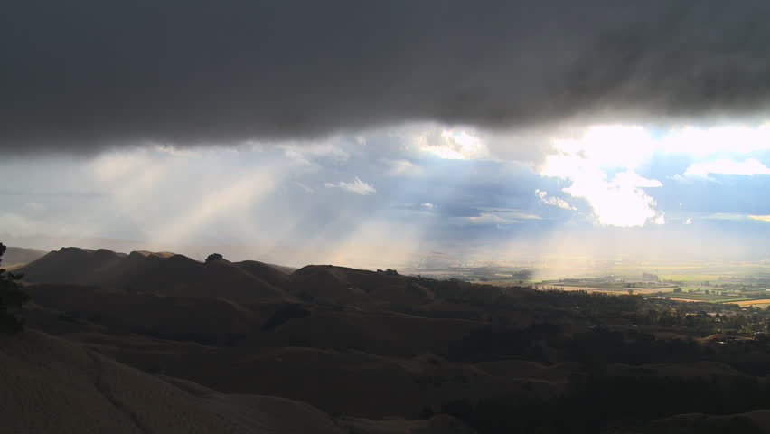A time lapse of clearing storm clouds as they pass over the plains below.