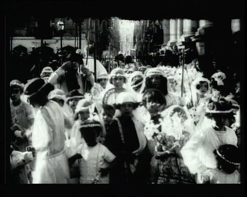 BARCELONA - CIRCA 1920: Ancient religious procession. Children's parade with different costumes. Popular event in Barcelona in the 20s. Vintage.