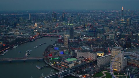 Dramatic aerial shot along the River Thames in Central London. Featuring well known landmarks including The London Eye, The Shard, City Financial District & Waterloo Bridge. Stock Video