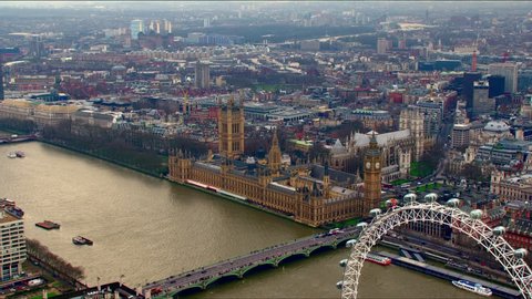 Stunning panoramic aerial shot along the River Thames in Central London. Features the Houses of Parliament & The London Eye.