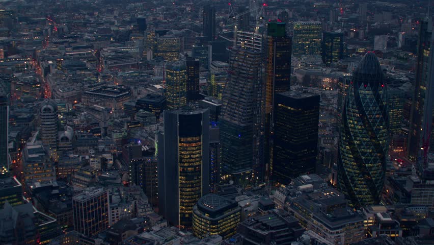 Dramatic early evening aerial shot over the City of London Financial District. Featuring The Gherkin / 30 St Mary Axe building. Royalty-Free Stock Footage #4835303