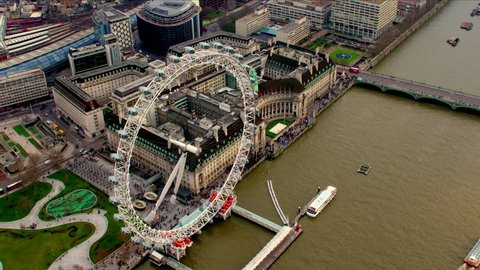 Aerial panorama of central London, UK. Features the River Thames, Millennium Wheel (London Eye), Waterloo and South Bank area.