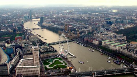 Aerial panorama of central London, UK. Features the River Thames, Millennium Wheel (London Eye), Waterloo and Houses of Parliament.