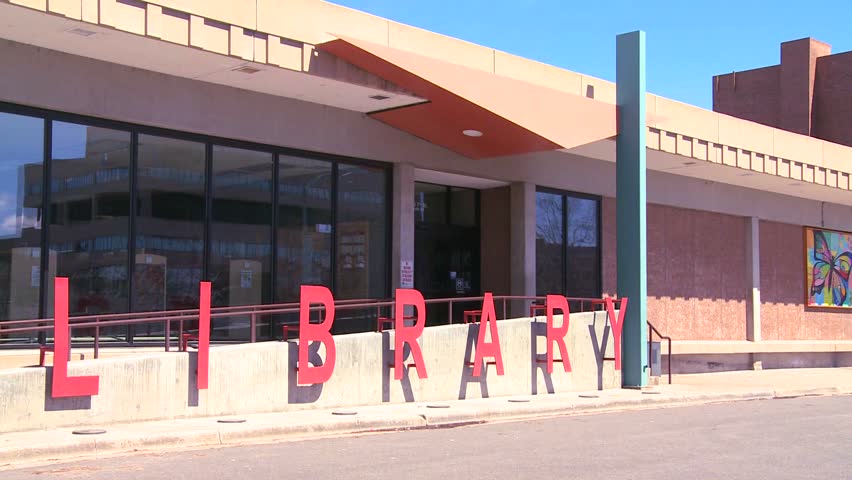 A modern American public library, establishing shot.