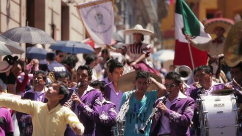 GUANAJUATO, MEXICO - 28 SEPTEMBER 2013: Folkloric band playing instruments during street parade DESFILE DE GUANAJUATO 2013