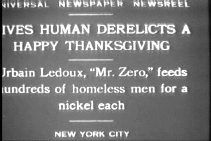 1920s - A man serves the homeless a Thanksgiving dinner in New York in 1929.