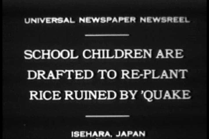 1930s - Schoolchildren replant rice after a huge earthquake hits Japan in 1930.