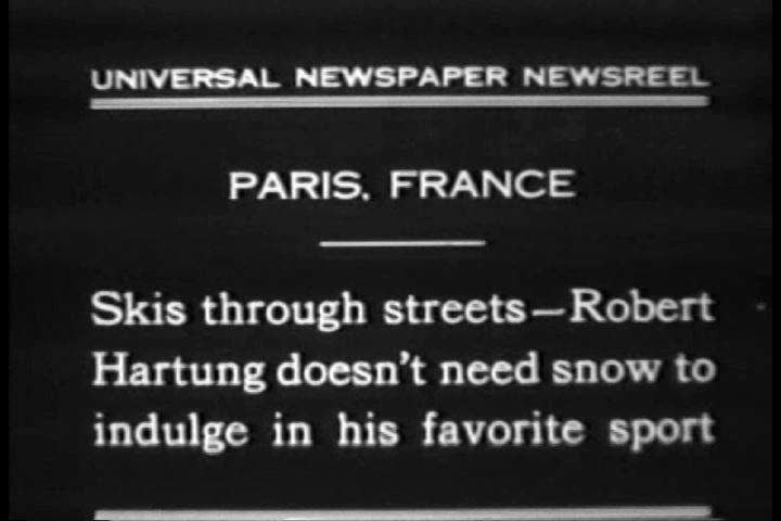 1930s - A man skis without snow on the streets of Paris France in 1930.