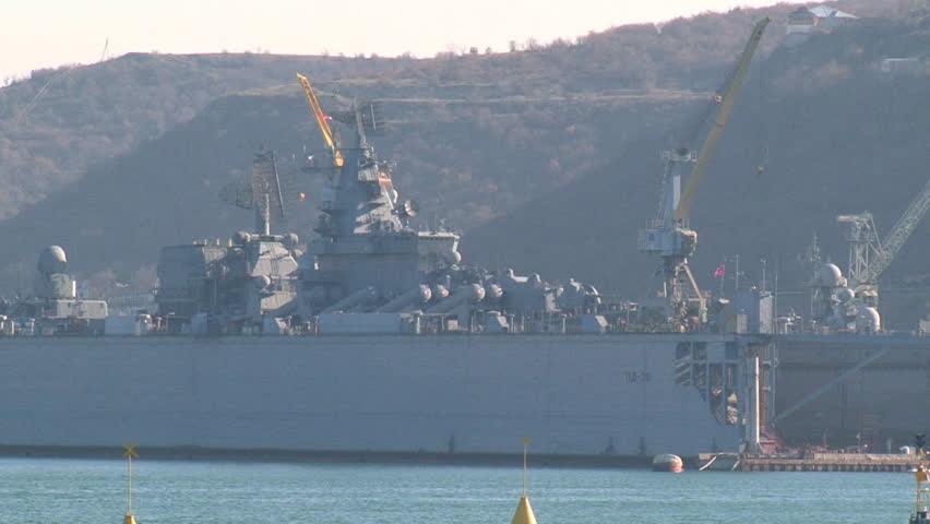 warship in the repair dock in the sea
