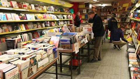 PARIS, FRANCE - OCTOBER 10: People looking for books in the book store at Saint-Michel area in Paris on October 10th 2013 in Paris, France