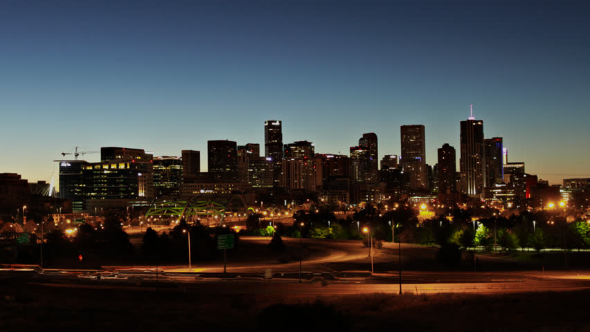 Downtown Denver, Colorado at Sunrise, with Interstate highway in the foreground.