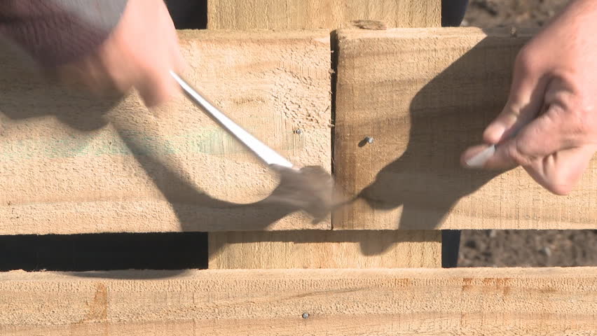Using a power saw to cut timber 