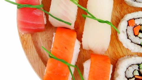 Maki Sushi and Nigiri - California Maki Roll made of fresh raw Salmon Cream Cheese and Avocado inside with Nigiri Sushi topped with Salmon Tuna and Eel. Isolated 1920x1080 intro motion slow hidef hd
