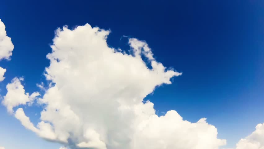 White clouds running over beautiful blue sky