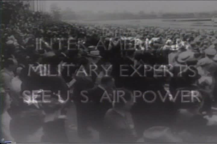 1940s - People watch a military air show during World War two.
